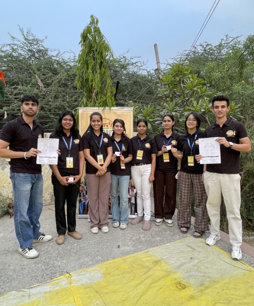 Students documenting fieldwork alongside community members